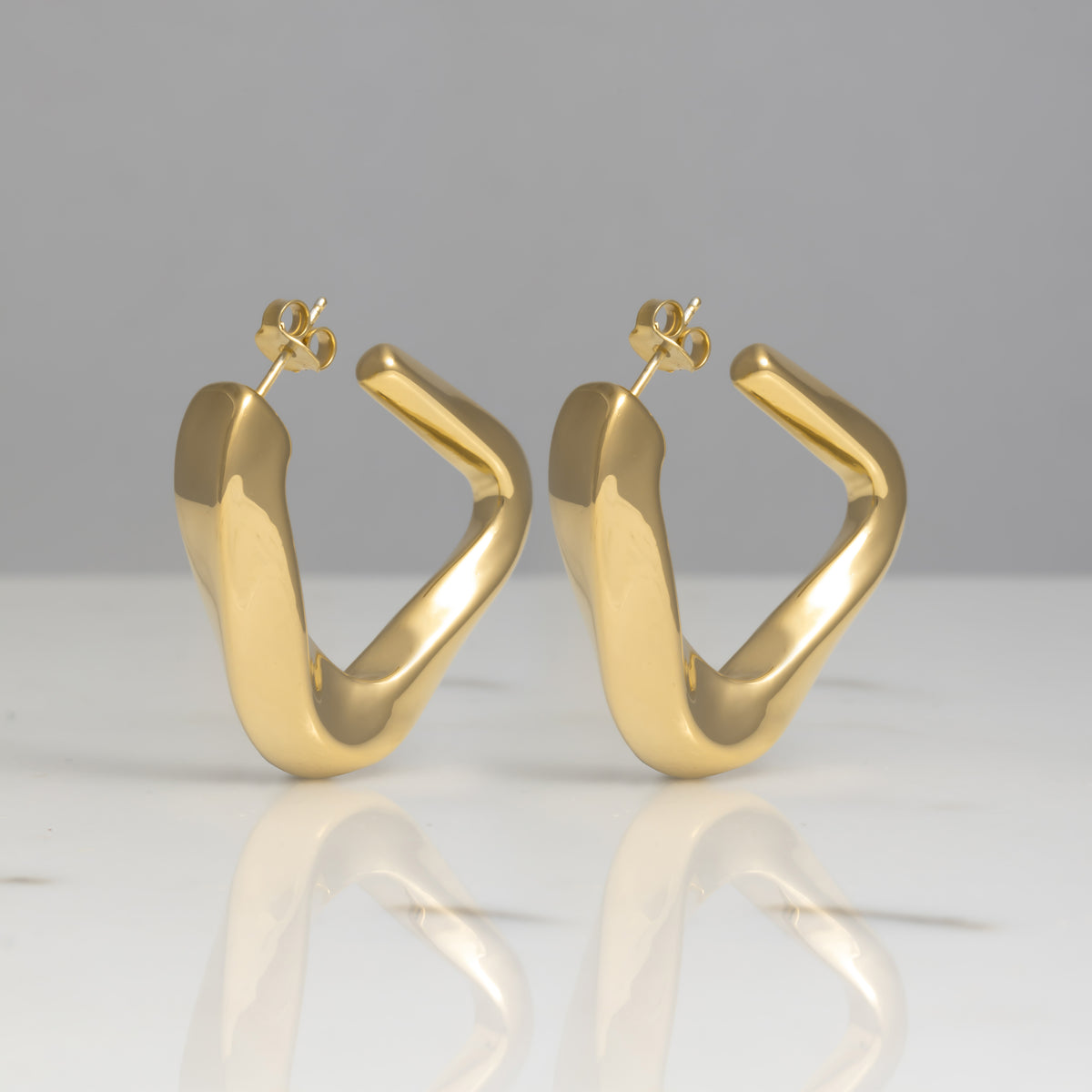 Orecchini Deng oro 18kt placcato