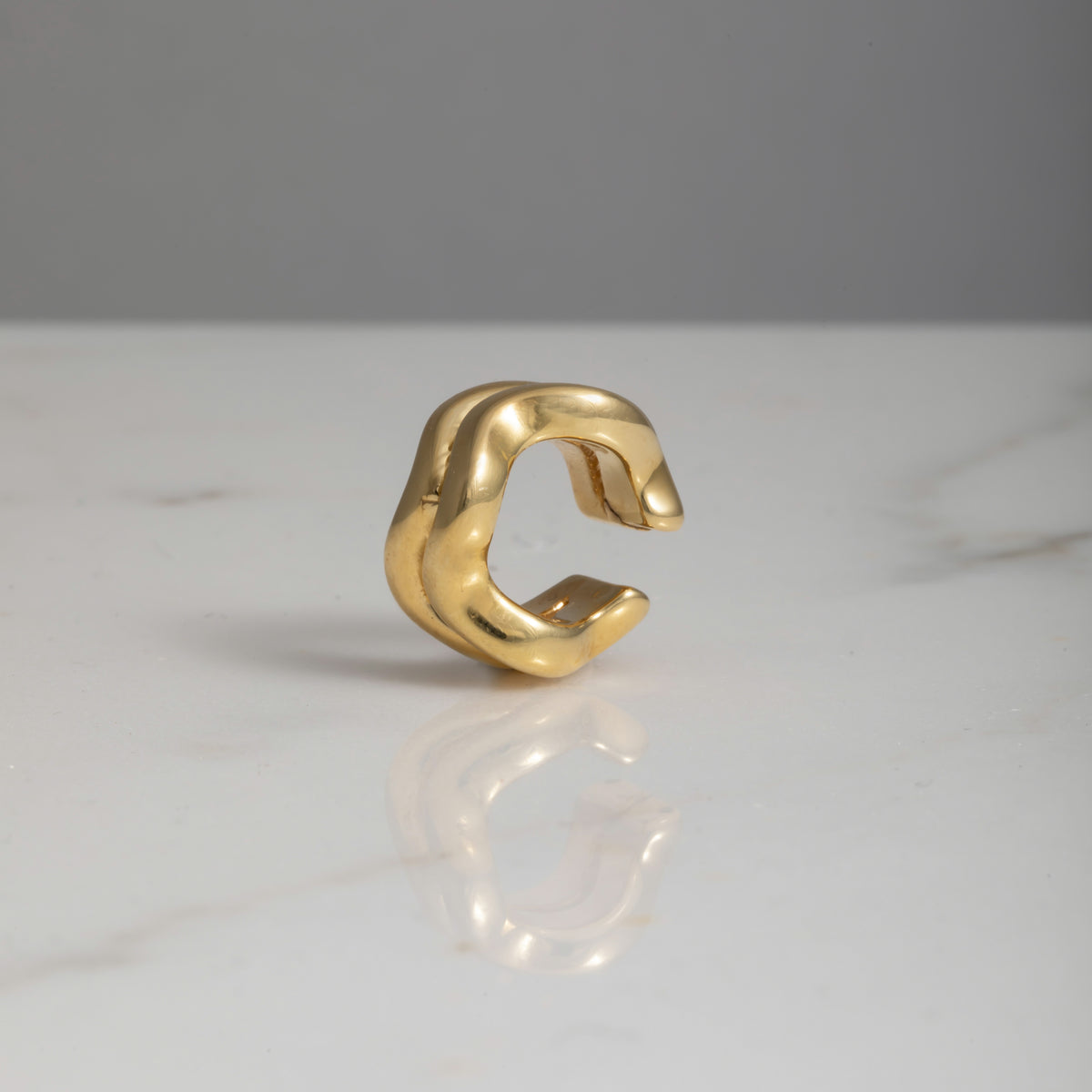 Ear cuff wave oro 18kt